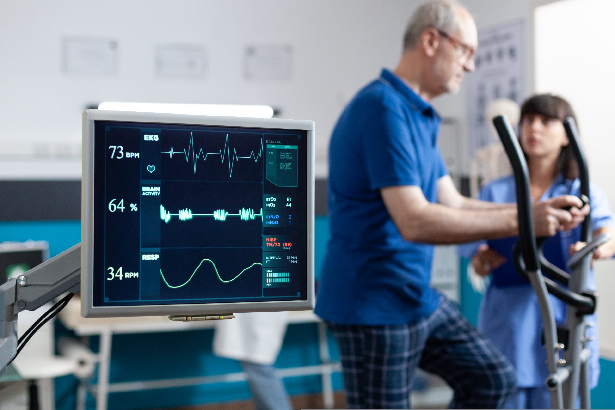 Close up of heart rate monitor measuring heartbeat for patient doing gymnastics for physical recovery.